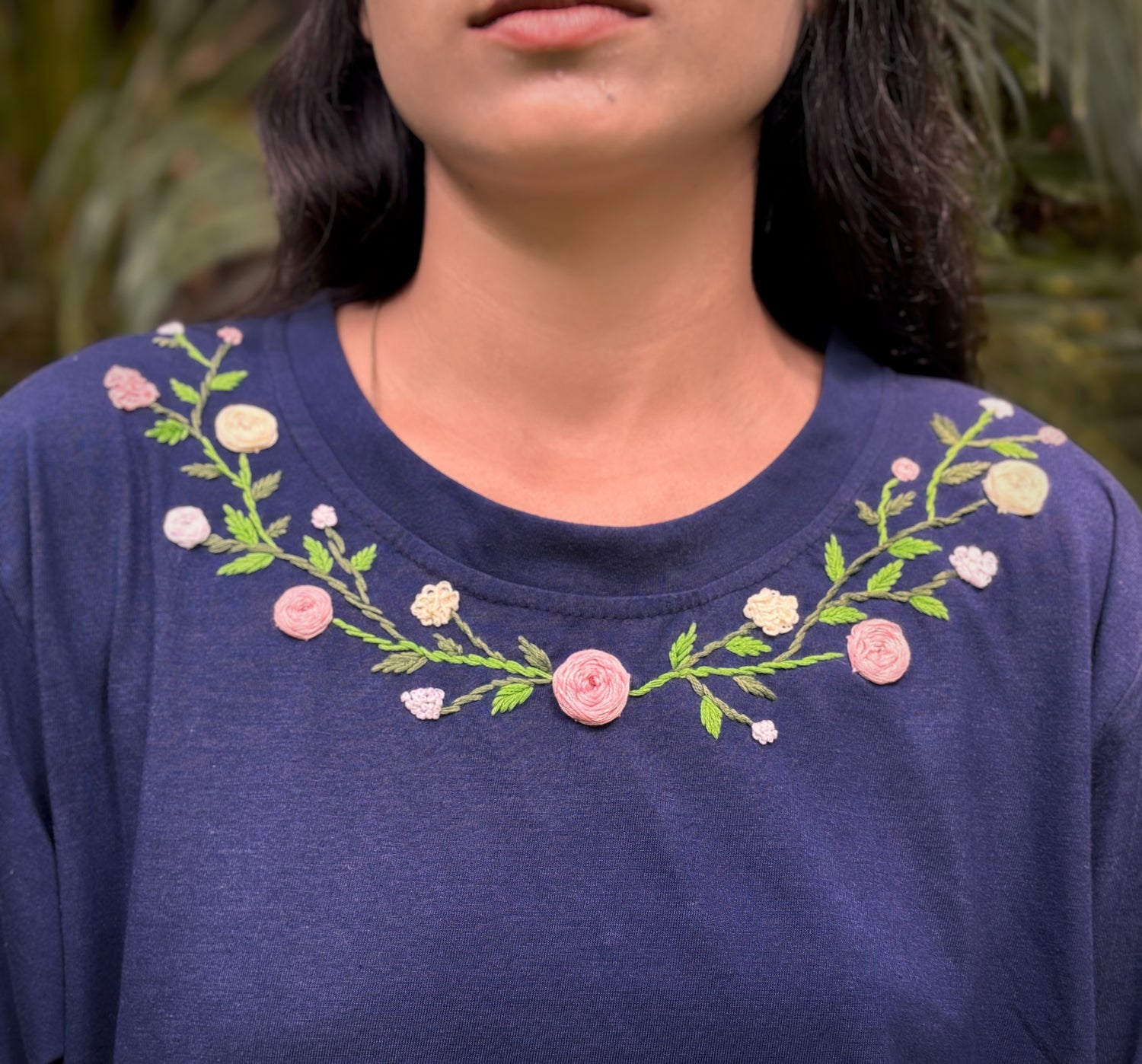 Nature-inspired embroidered women’s cotton tee with pastel blossoms
